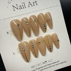 Elegant Nude Press-On Nails with Gold Accents